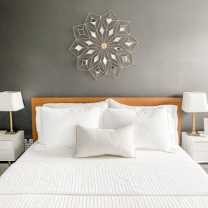 Before and after image of a bedroom tidied by Zen Cleaners.