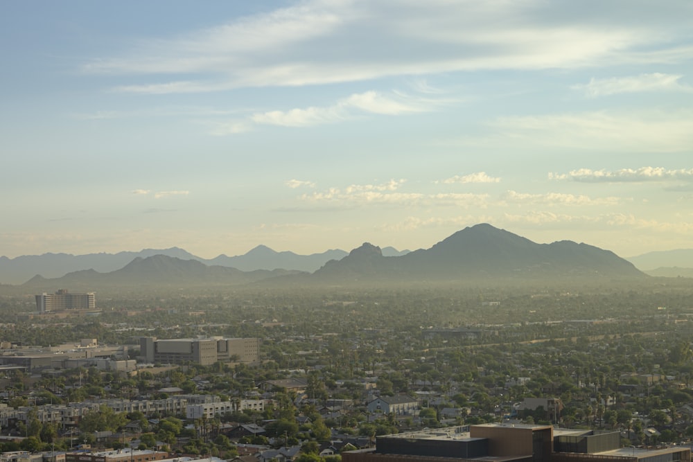 a view of a city with mountains in the background