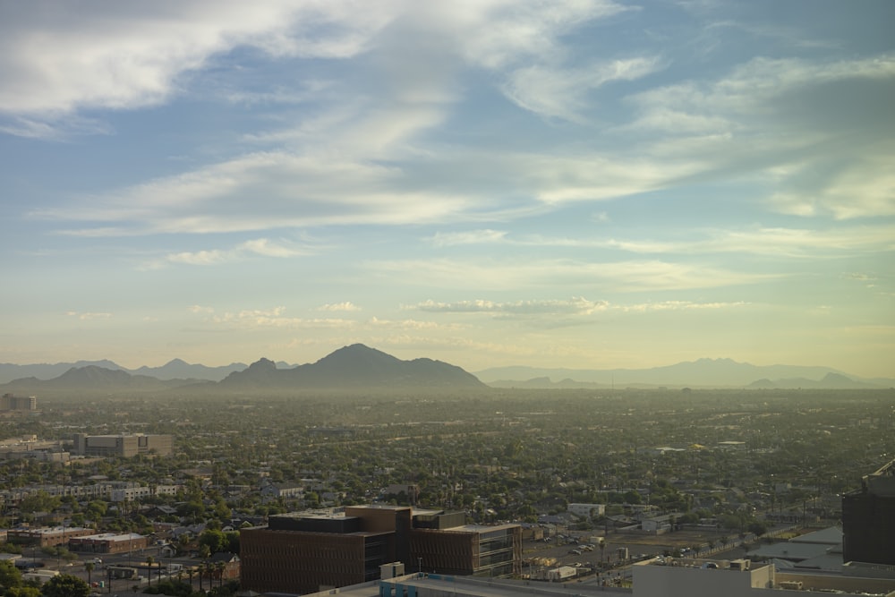 a view of a city with mountains in the background