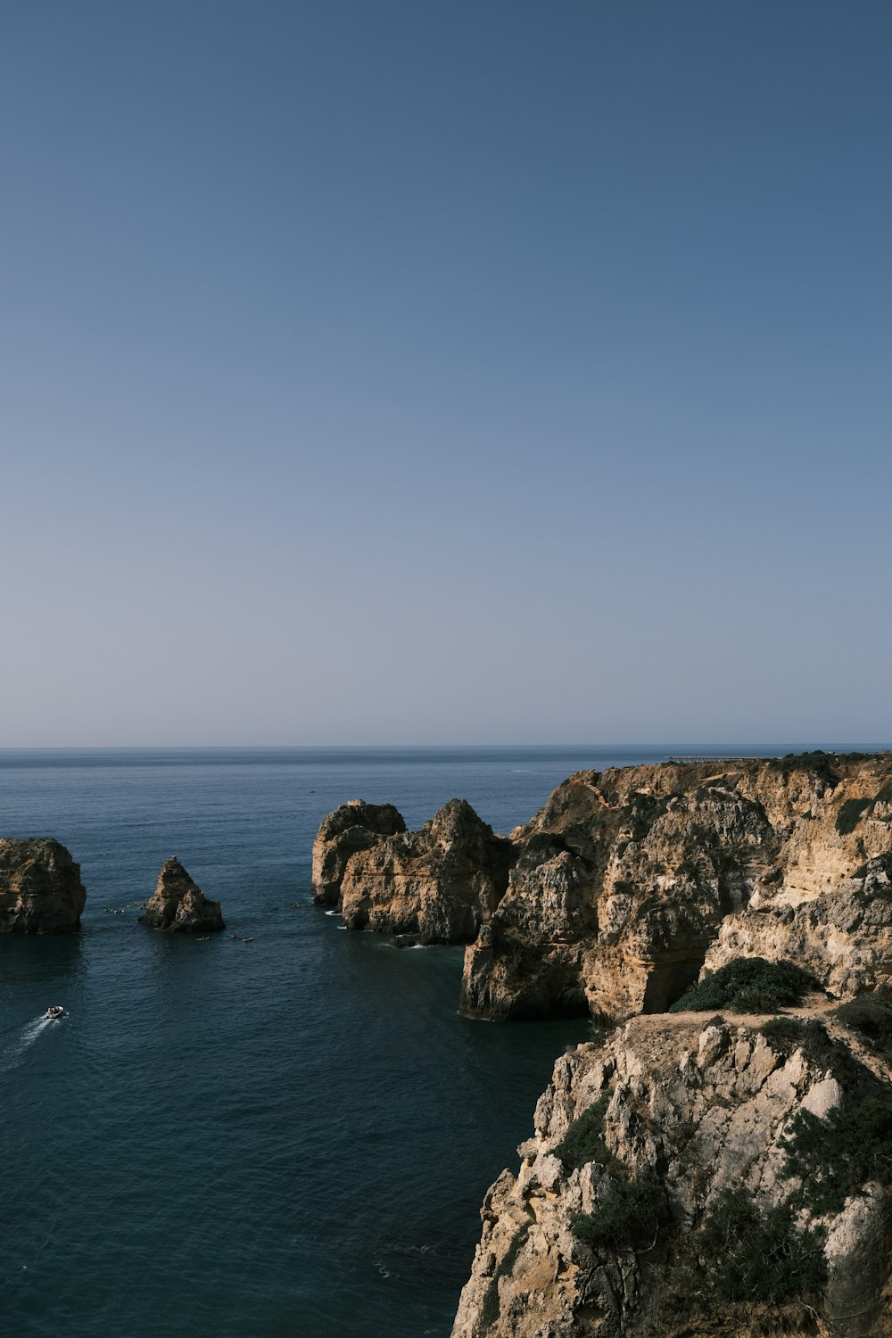 a view of a body of water from a cliff