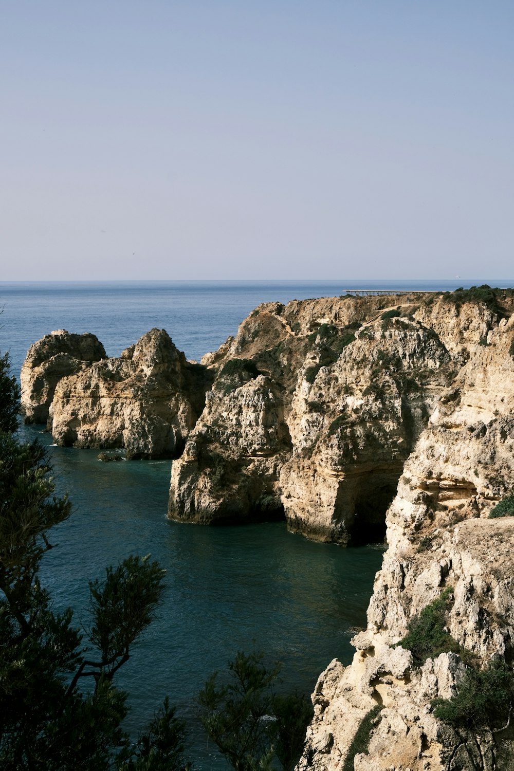 a body of water surrounded by rocks and trees