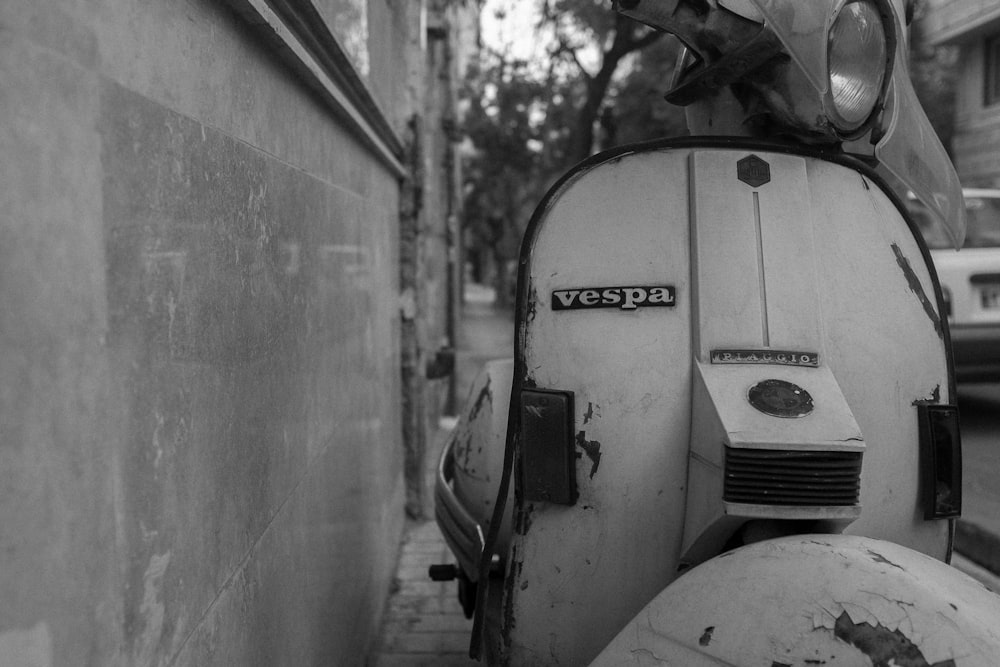 a scooter parked on the side of a street