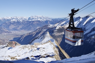 a ski lift going up the side of a mountain