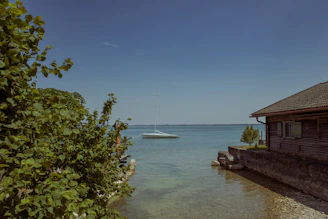 A serene lakeside scene with a perfectly detailed boat ready for a day on the water