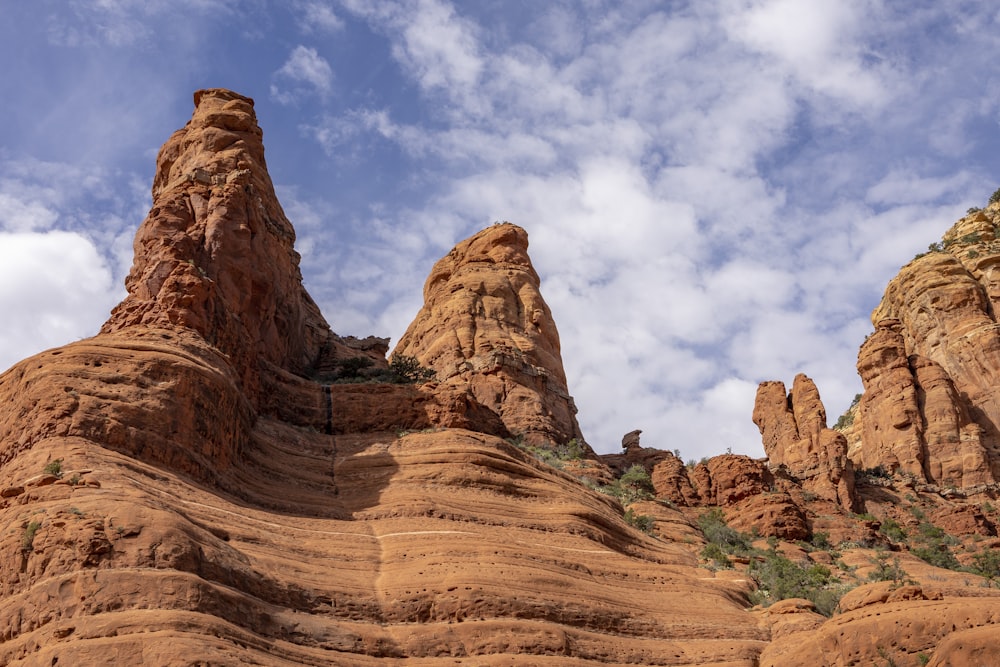 a large rock formation in the middle of a desert