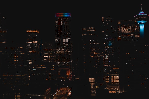 a view of a city at night from the top of a building