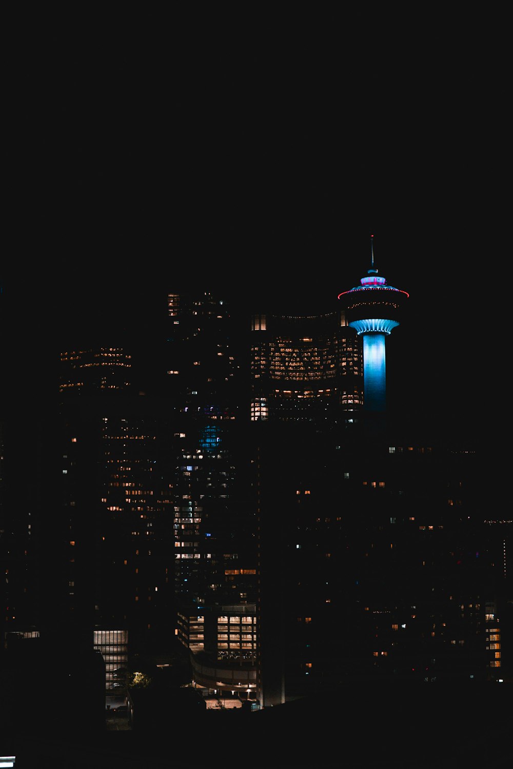 a view of a city at night from a distance