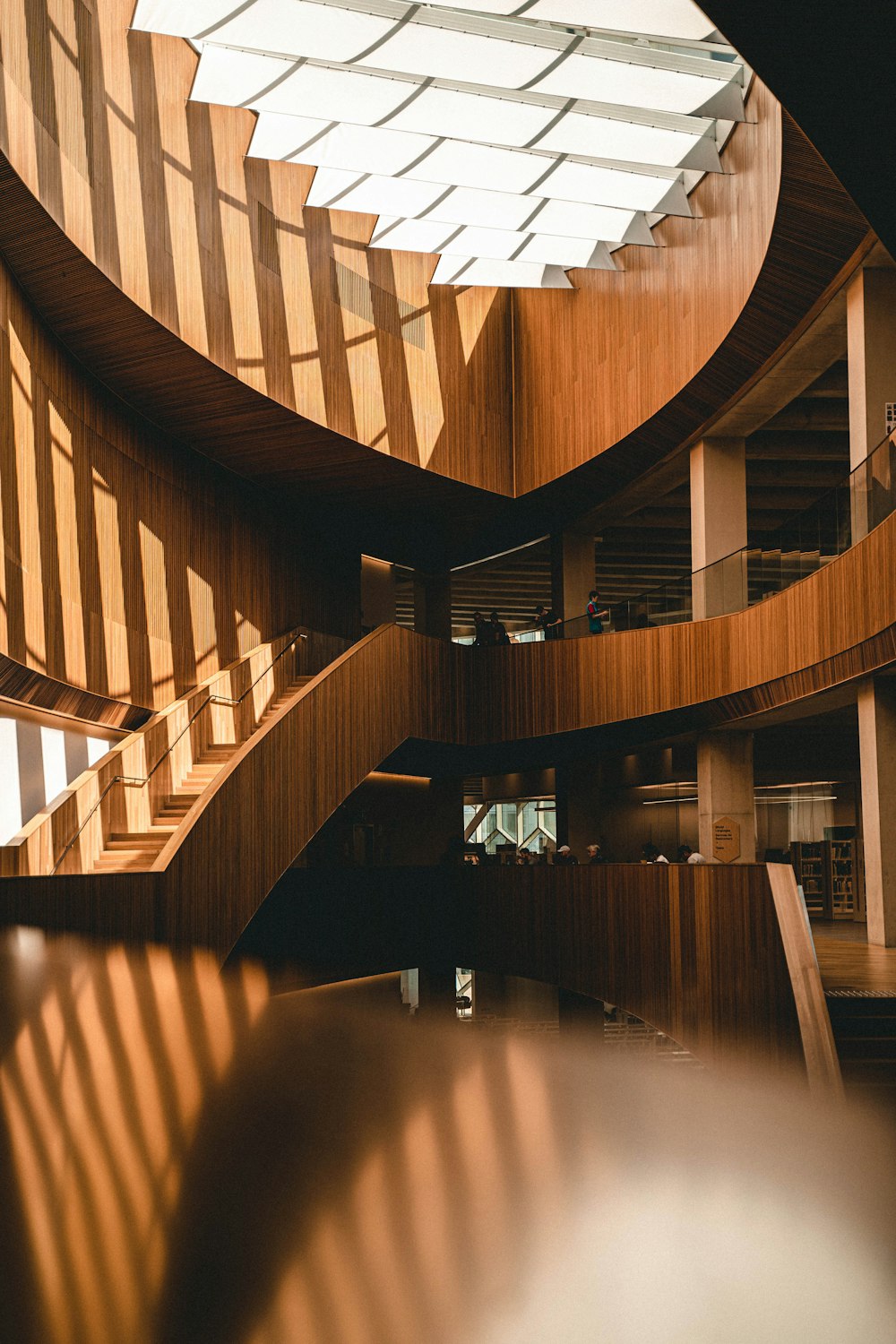 a spiral staircase in a building with a skylight