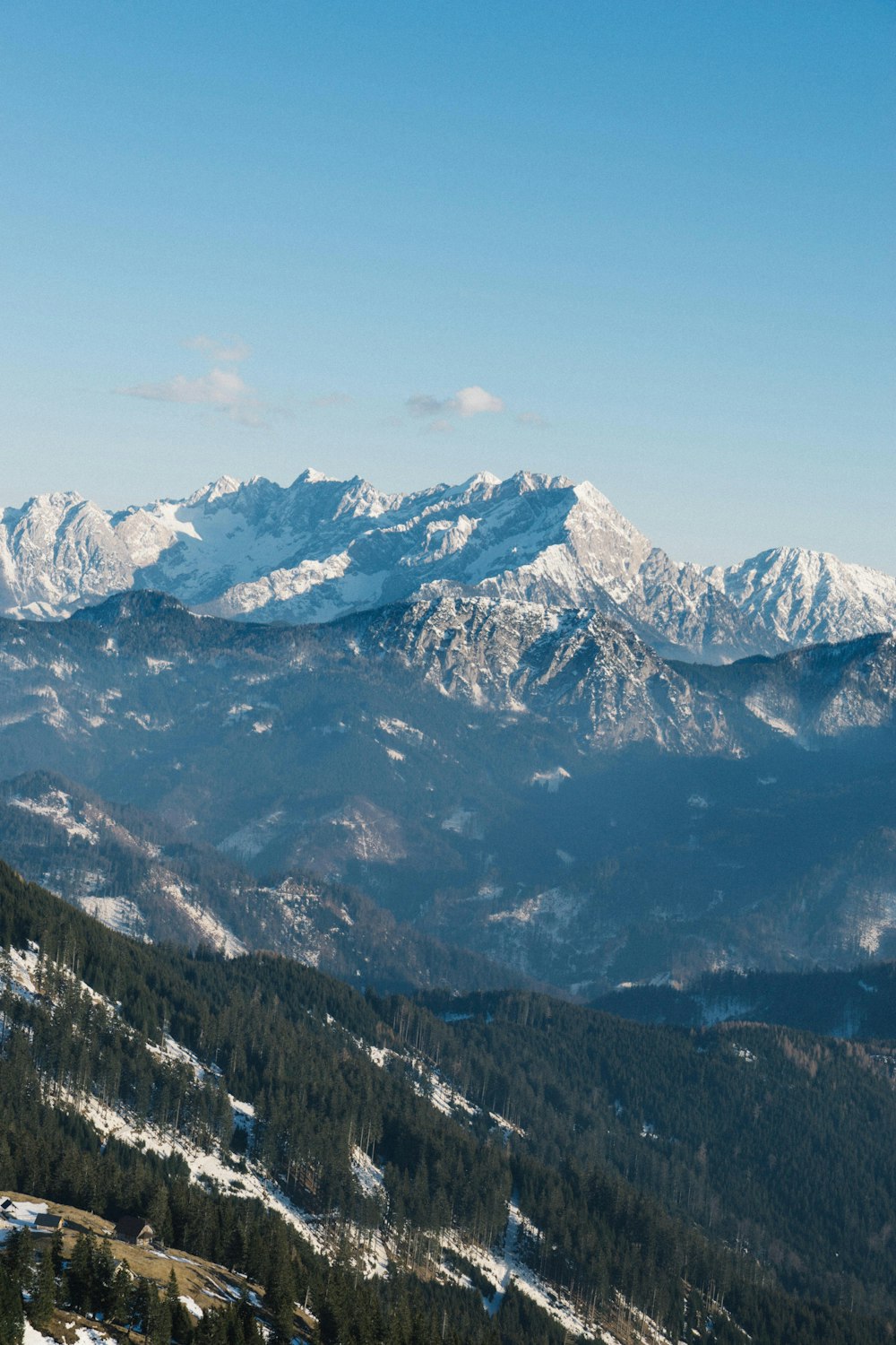 a view of a mountain range covered in snow