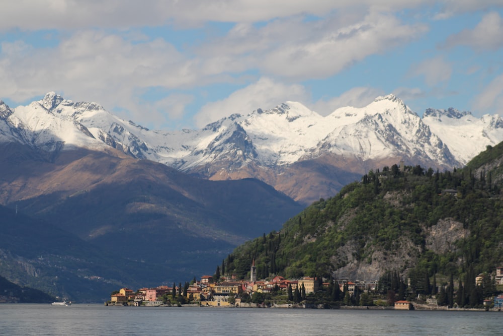 a view of a mountain range with a lake in the foreground