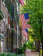A cozy neighborhood in Lebanon with classic brick houses and front porches.