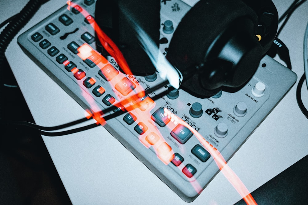 a close up of a keyboard and a pair of headphones