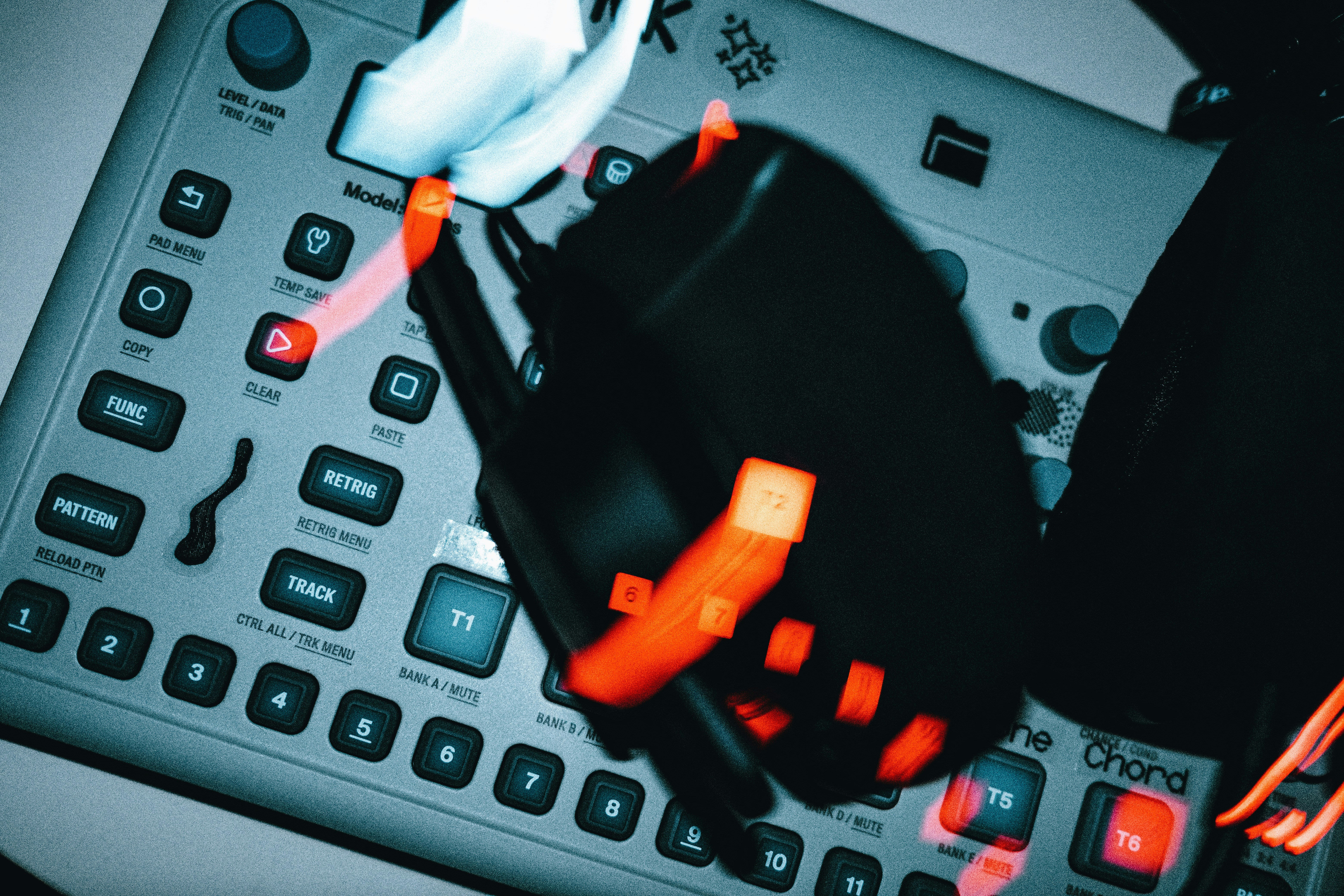 a close up of a calculator with a glove on top of it