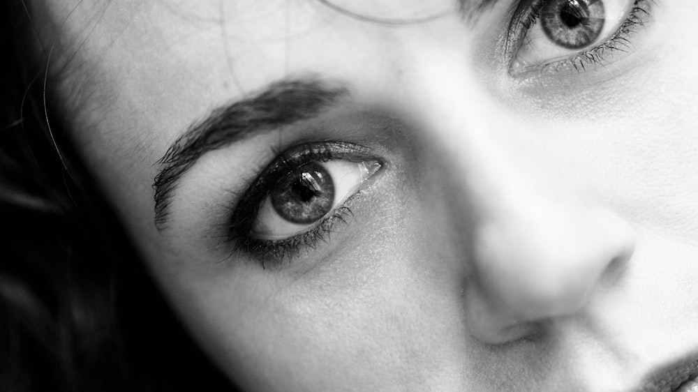 a black and white photo of a woman's eyes