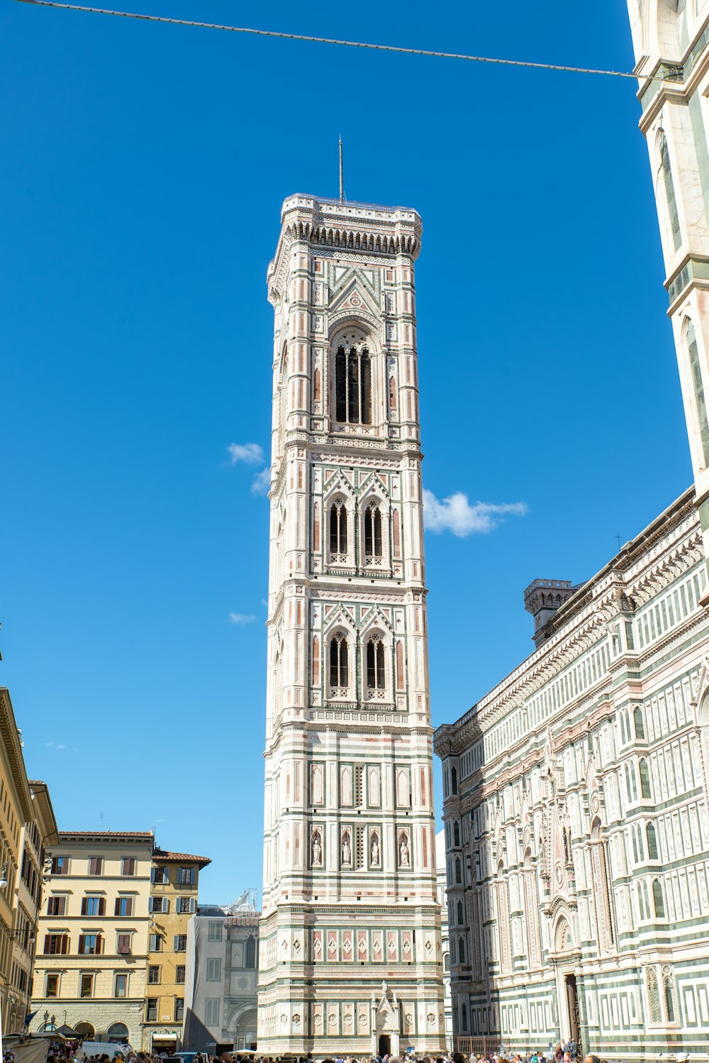 a tall tower with a clock on the top of it