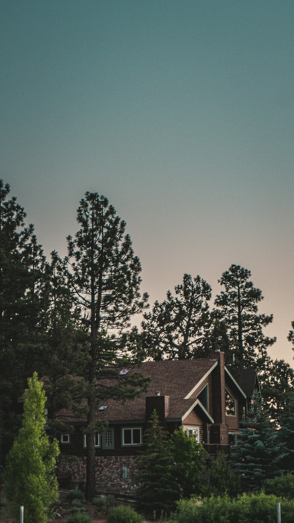 a house with a clock tower in front of it