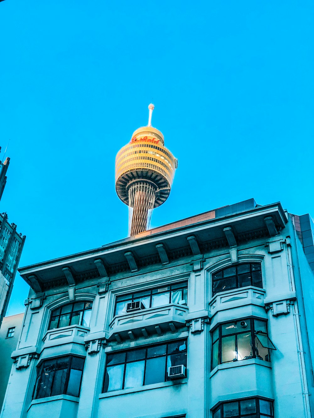 a tall building with a water tower in the background