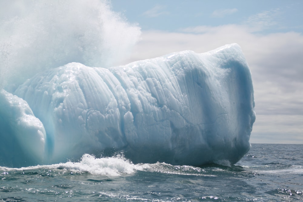 a large iceberg in the middle of the ocean