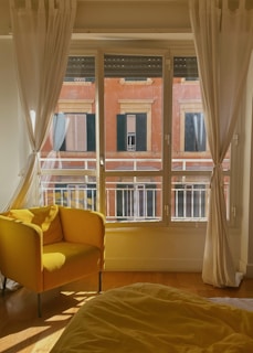 Unloading furniture gently into a bright, new apartment under natural sunlight.