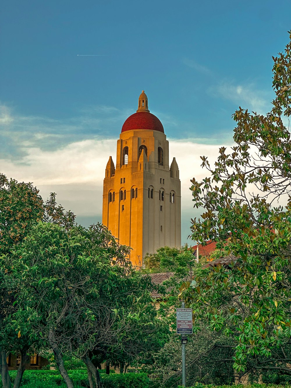 a tall building with a red dome on top of it