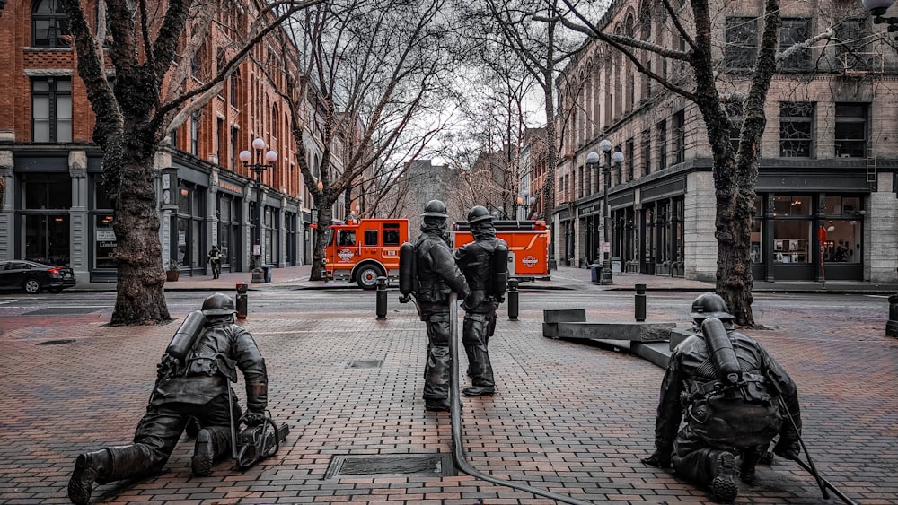 a group of soldiers standing on top of a sidewalk