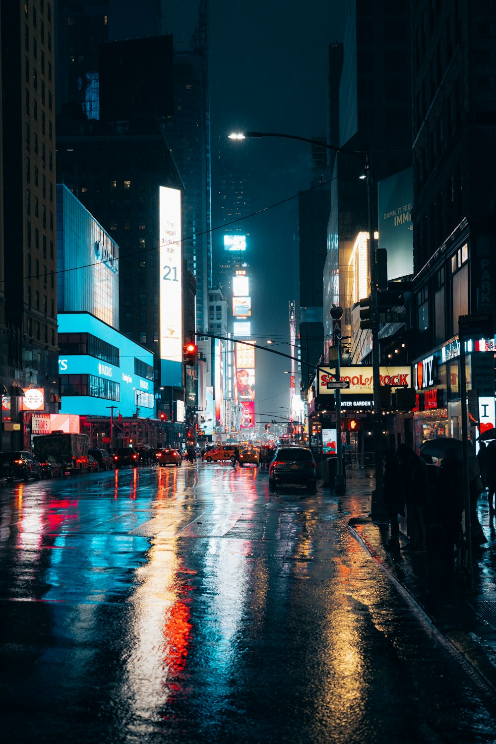 a city street at night with a lot of traffic