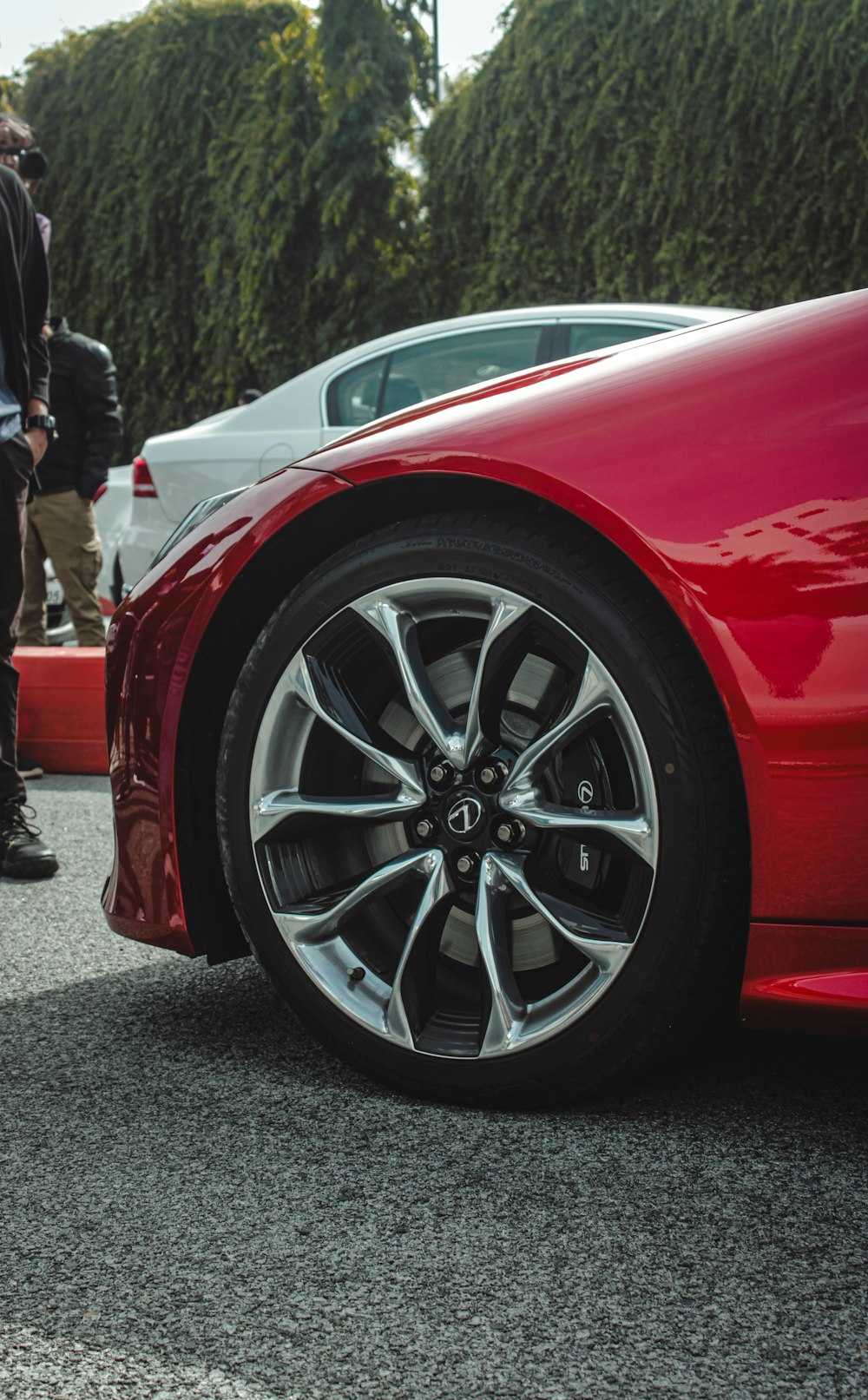 a red sports car parked in a parking lot