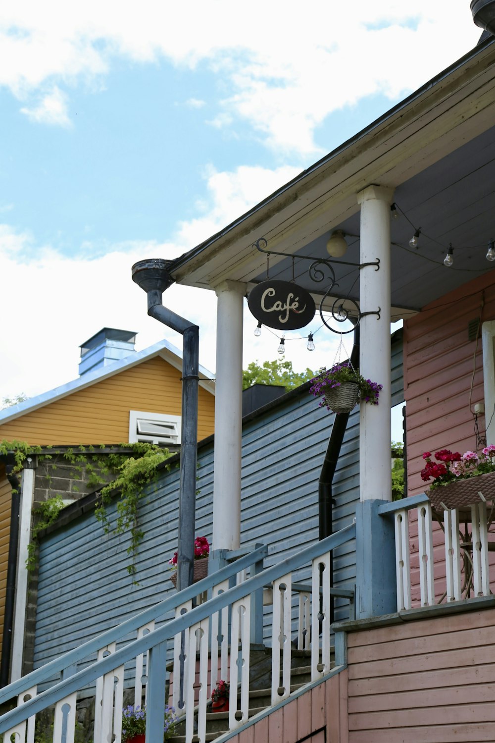 a building with a sign that says cafe on the front of it