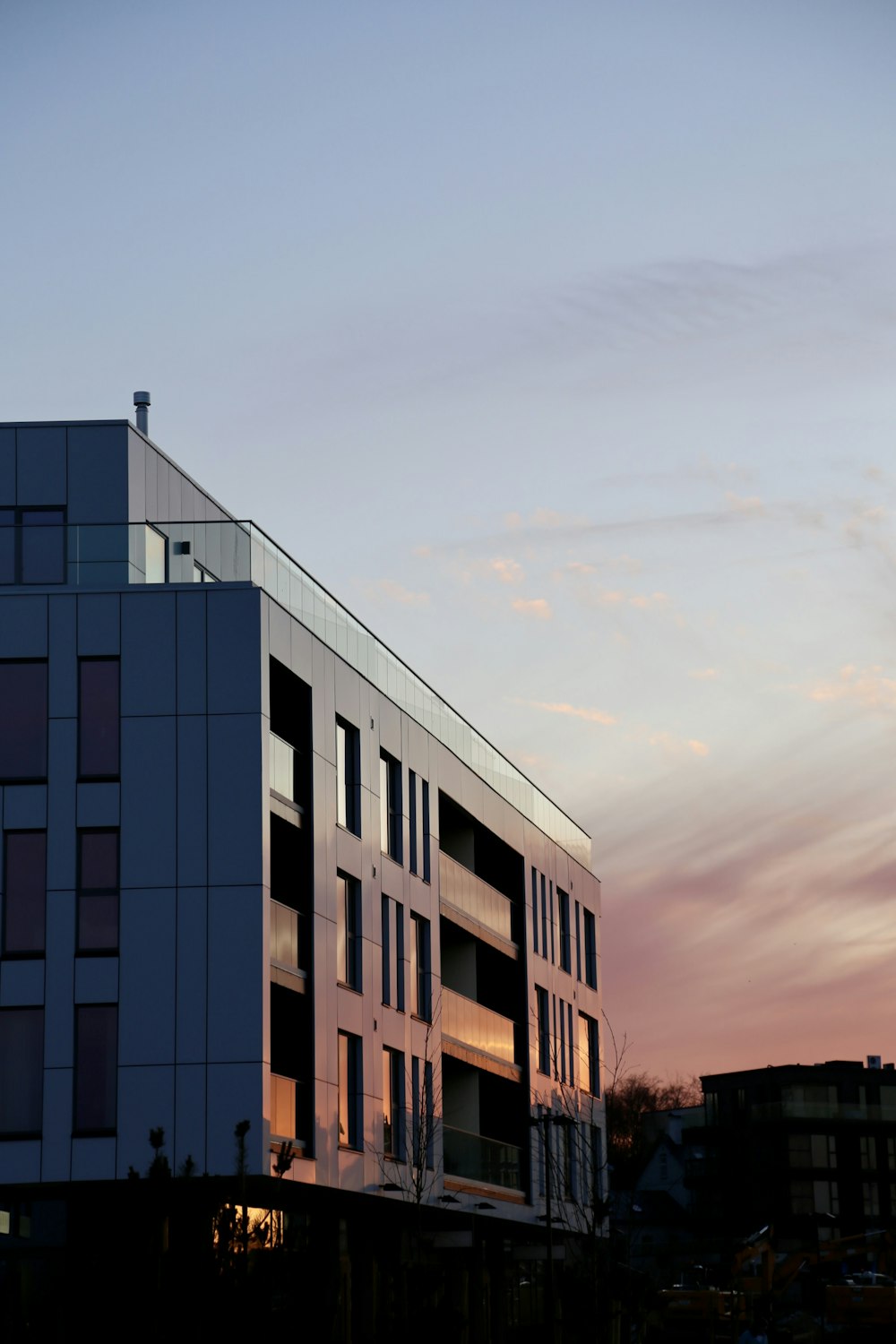 a tall building with a sky in the background