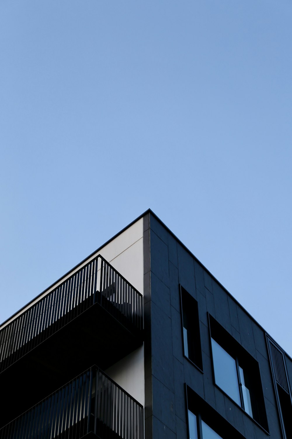 a tall building with balconies and balconies on top