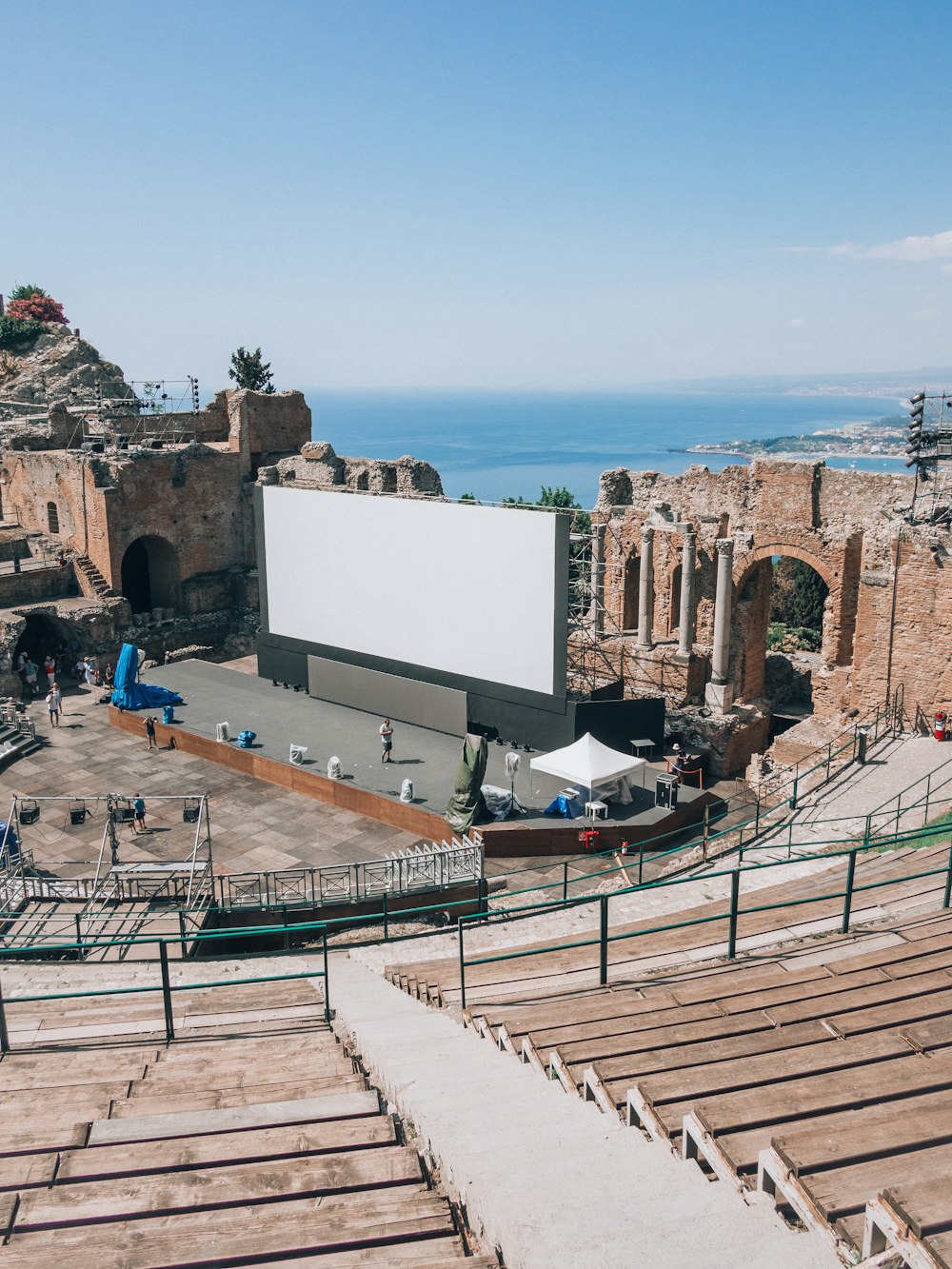 an empty theater with a large screen in the middle of it