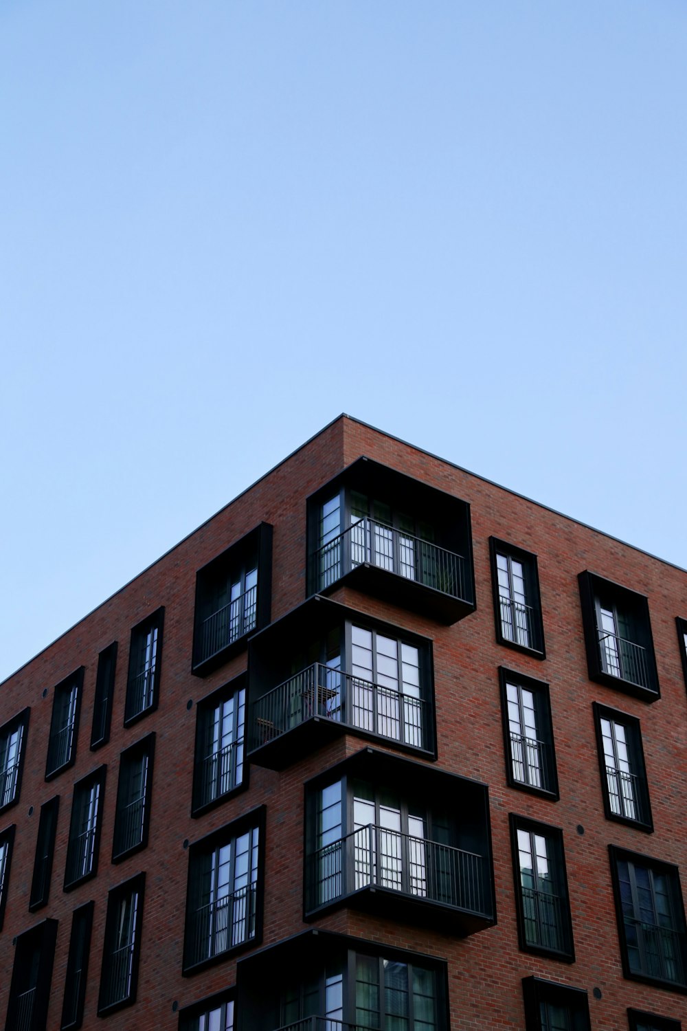 a tall brick building with lots of windows