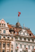 Historic old town buildings with traditional Swiss architecture under a clear blue sky.