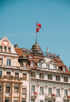 Historic old town buildings with traditional Swiss architecture under a clear blue sky.