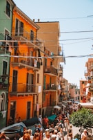 Colorful street scene from Cartagena with lively animated people and music notes.