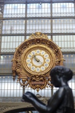 a large clock mounted to the side of a building