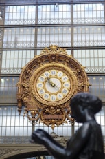 a large clock mounted to the side of a building