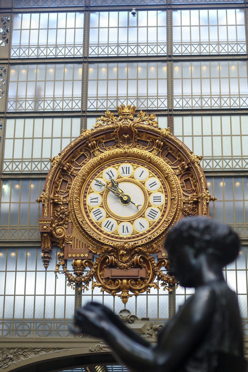 a large clock mounted to the side of a building