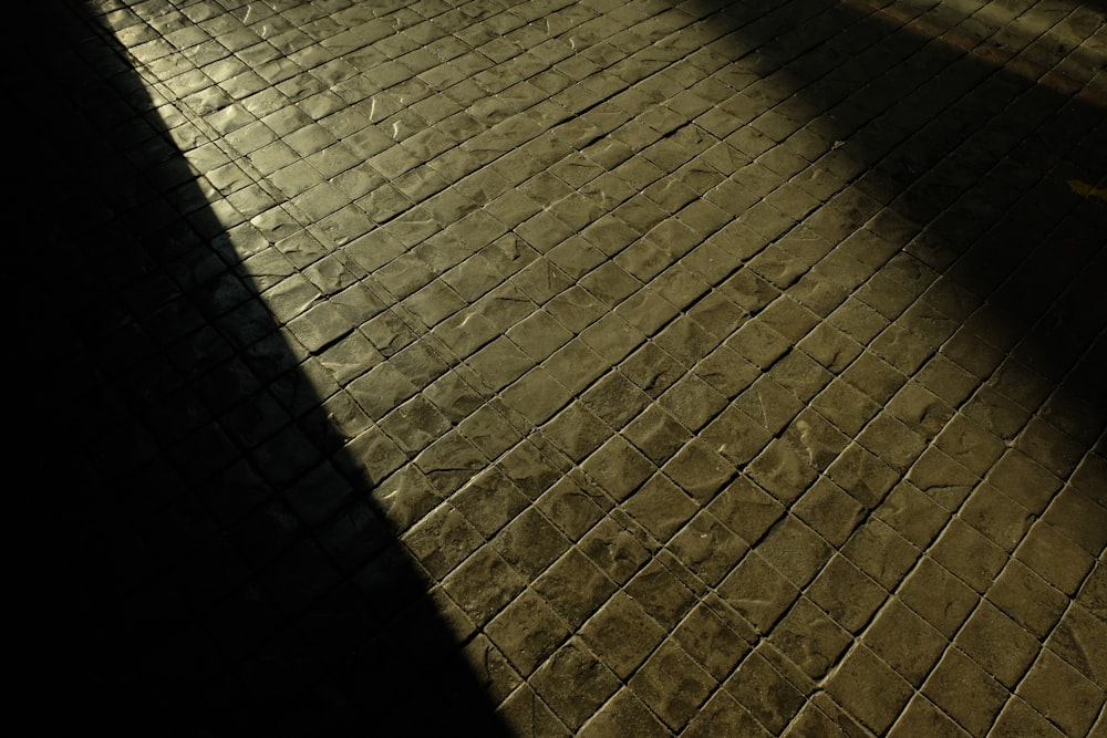 a person walking down a sidewalk at night