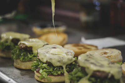 Sleek automated hamburger machine cooking and wrapping fresh burgers.