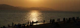 Photograph of a quiet Benidorm beach at sunset, perfect for a walking route.