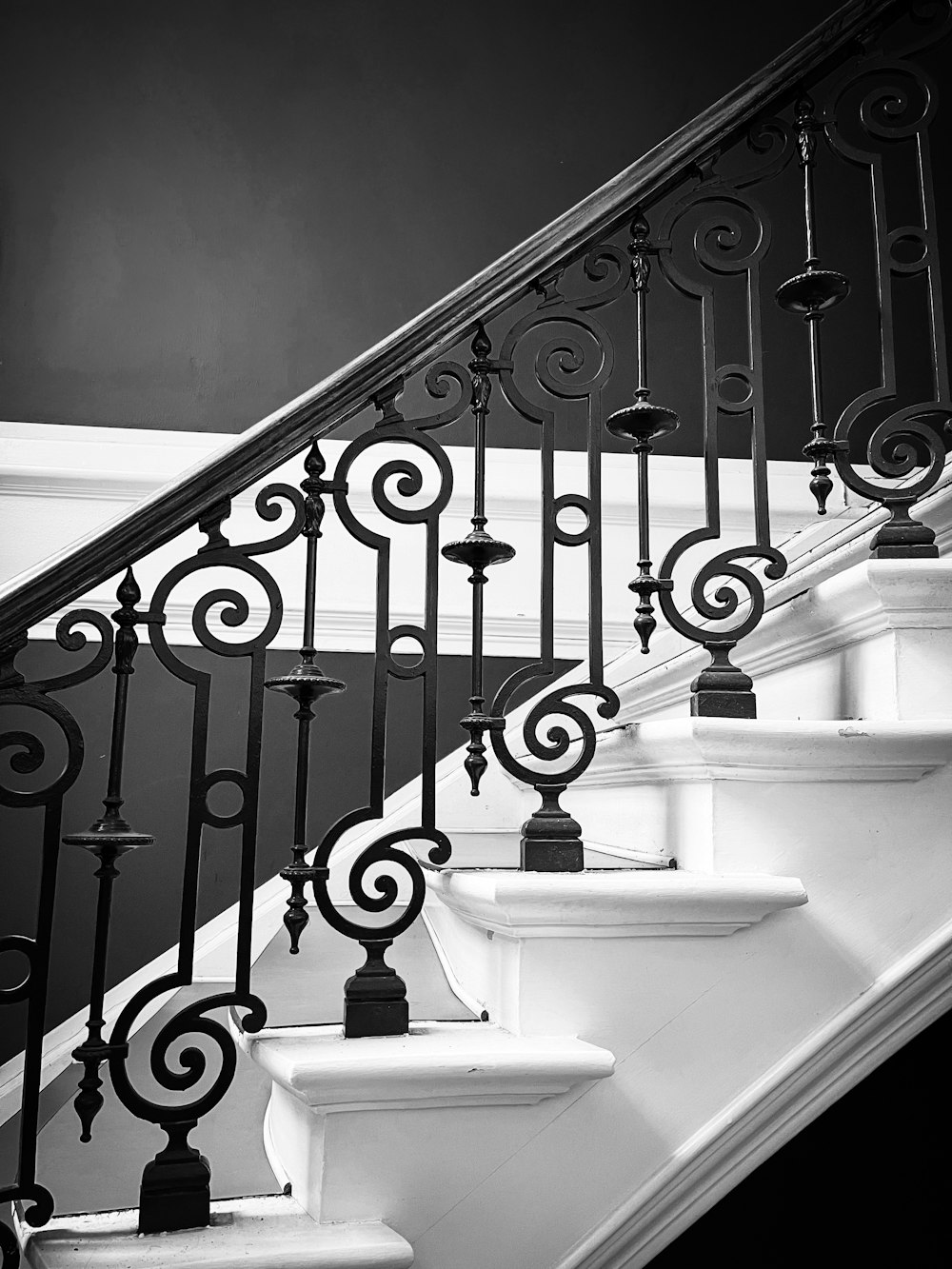 a black and white photo of a stair case