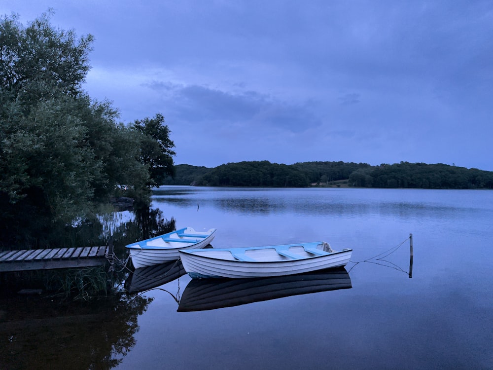 a couple of boats that are sitting in the water