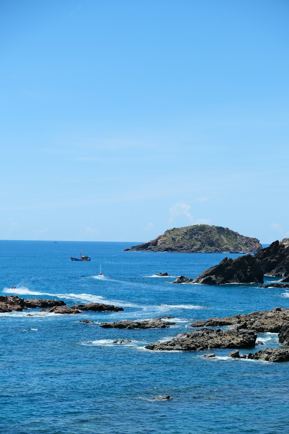 a body of water with a boat in the distance