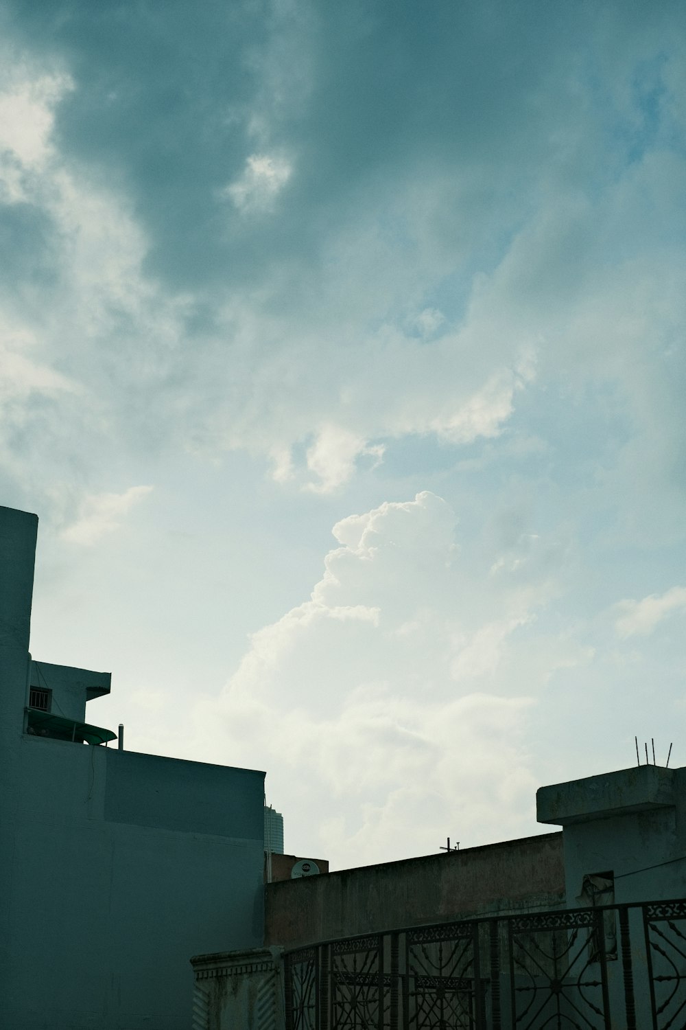 an airplane flying in the sky over a building