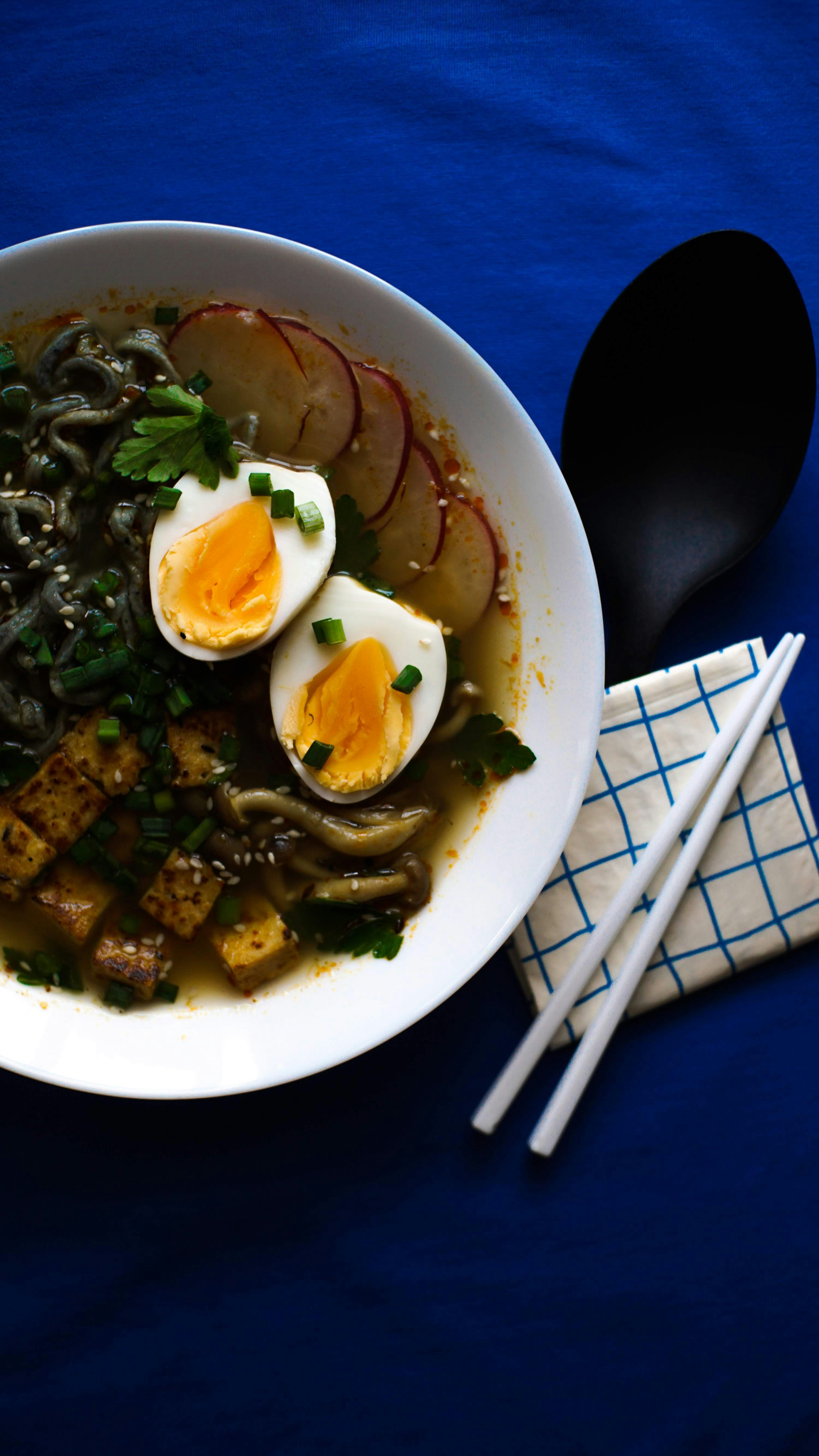 a bowl of food on a blue table cloth
