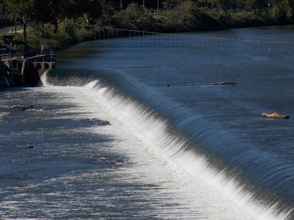 a large body of water with a waterfall coming out of it