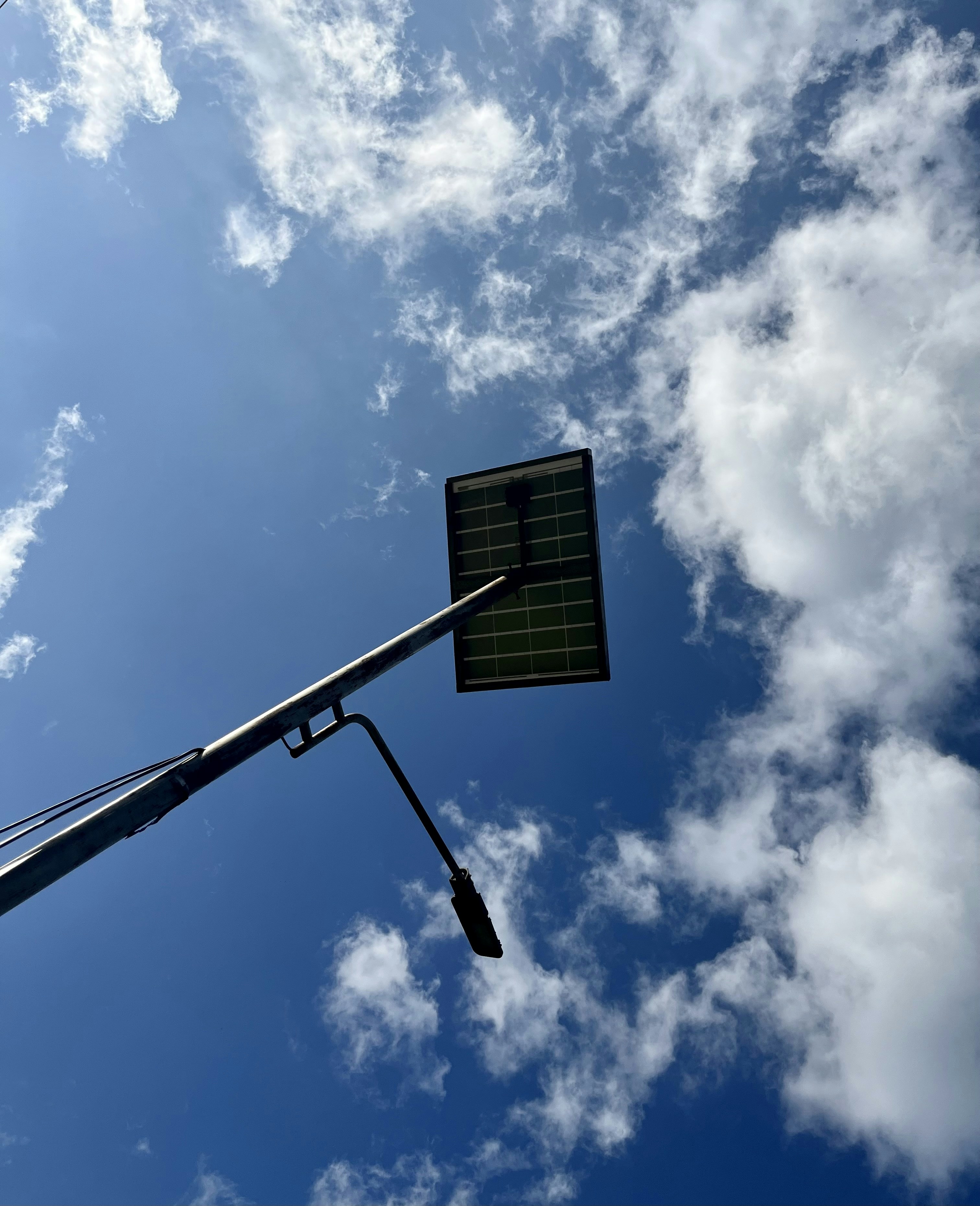 a street light with a sky background