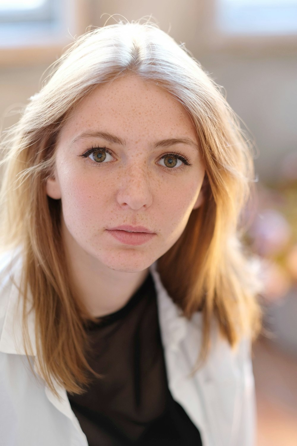 a close up of a person wearing a white jacket