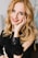 a woman with long blonde hair wearing a black dress